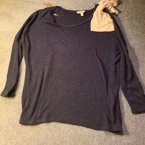 Lightweight blue sweater with decorative white bow